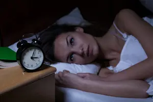woman in bed with insomnia