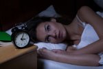 woman in bed with insomnia