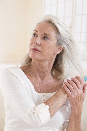 Senior Woman Brushing her Hair